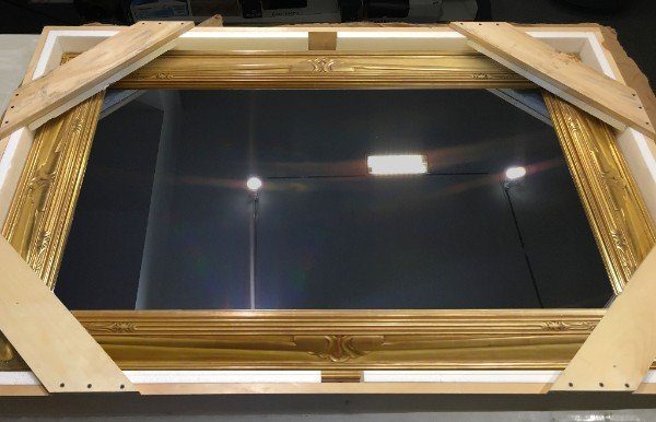 a crated reflectel mirror tv