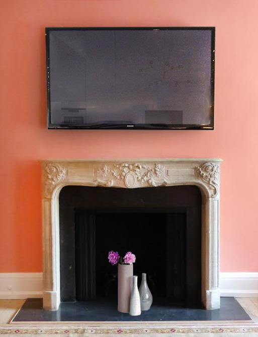 ugly black plastic samsung television hangs over mantle