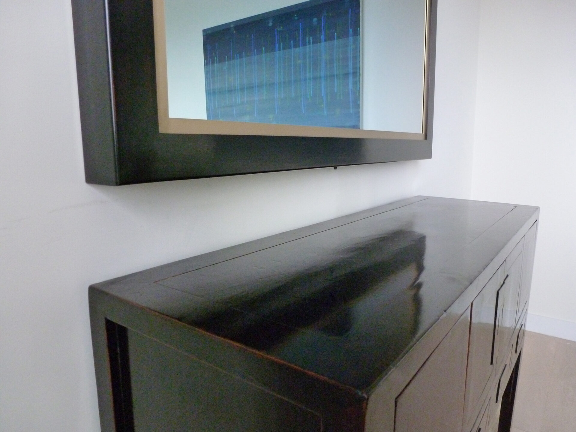 dark blue square reflectel mirror tv in dining room