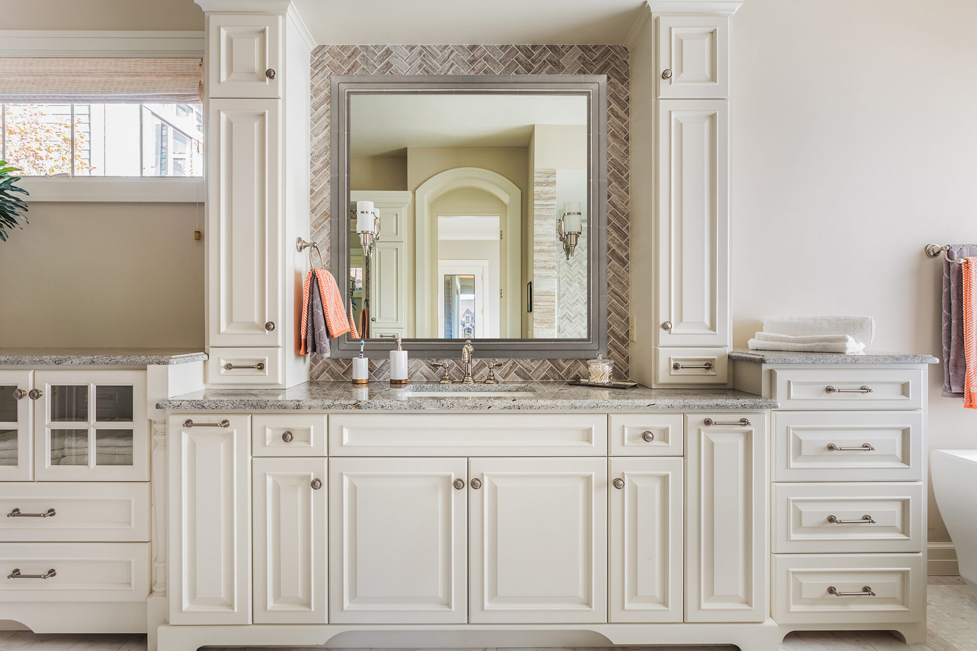 reflectel mirror tv hangs over a sink in a bathroom while off