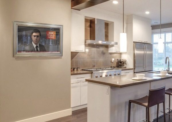 reflectel mirror tv hangs in kitchen