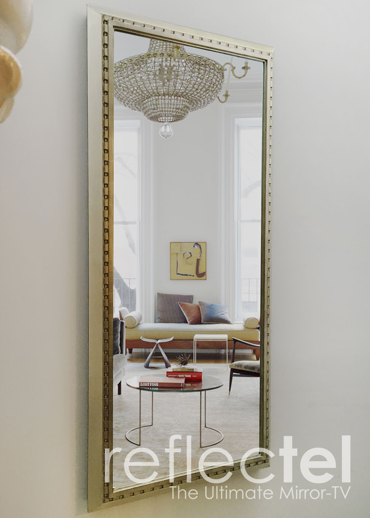 Gold Reflectel Mirror Tv Hangs On The Wall Of A Living Room Portfolio