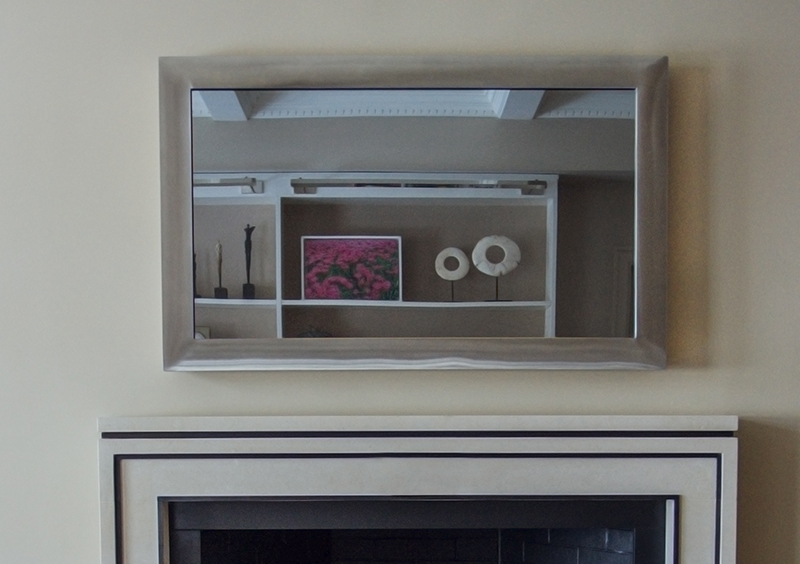 a metal silver steel mirror tv in new york city apartment off