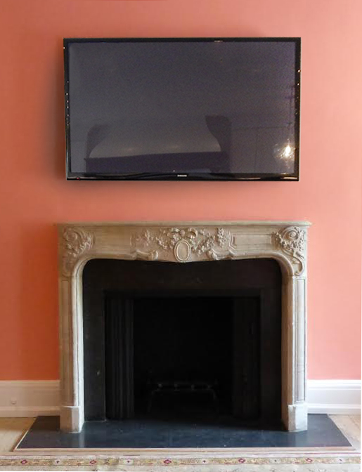 Old Black Samsung Tv Hangs Over Stone Mantle On Peach Wall