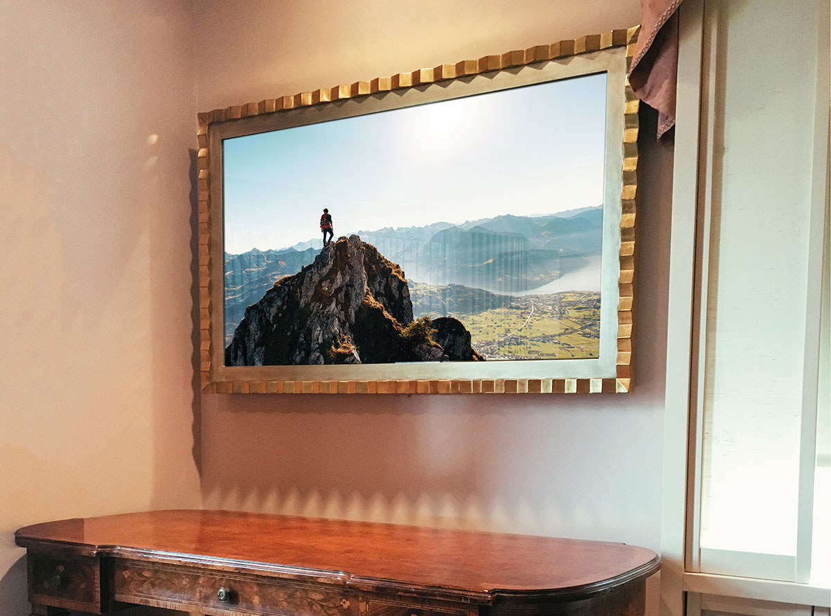Gold Gilded Reflectel Mirror Tv Hangs Over Desk Turned On