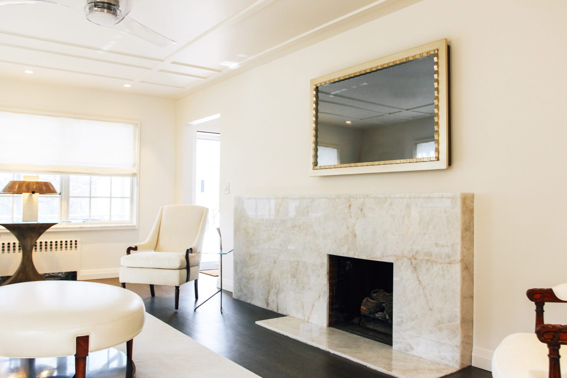 Mirror TV OFF With Gold Gilded Frame Over Marble Fireplace