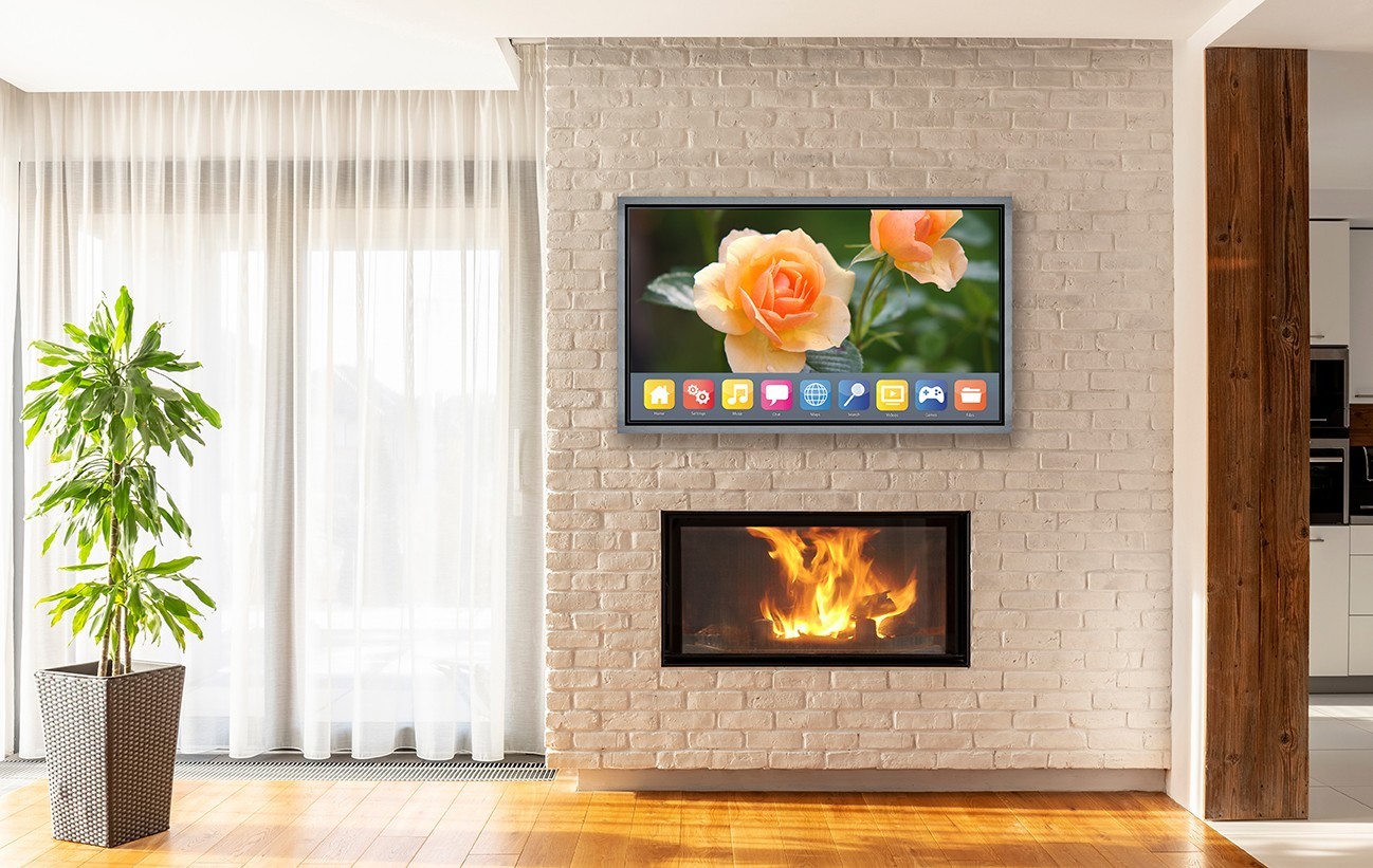 TV With Float Silver Frame Above Fireplace