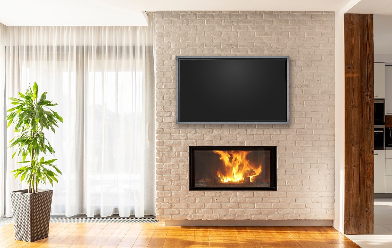 Float Frame Tv With Silver Frame Above Fireplace