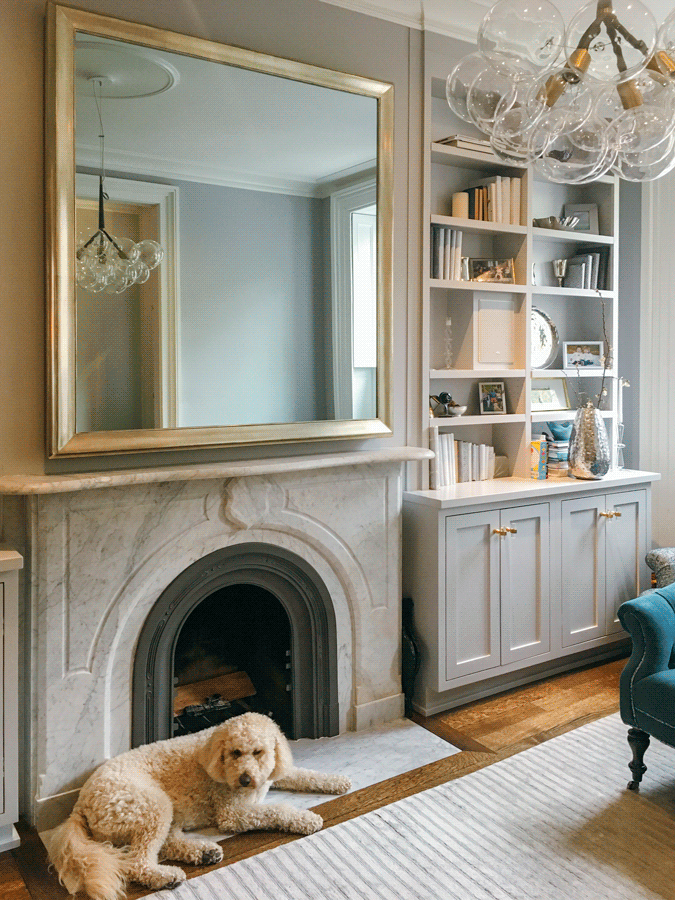 Mirror TV on with gold frame over stone mantle quality highest