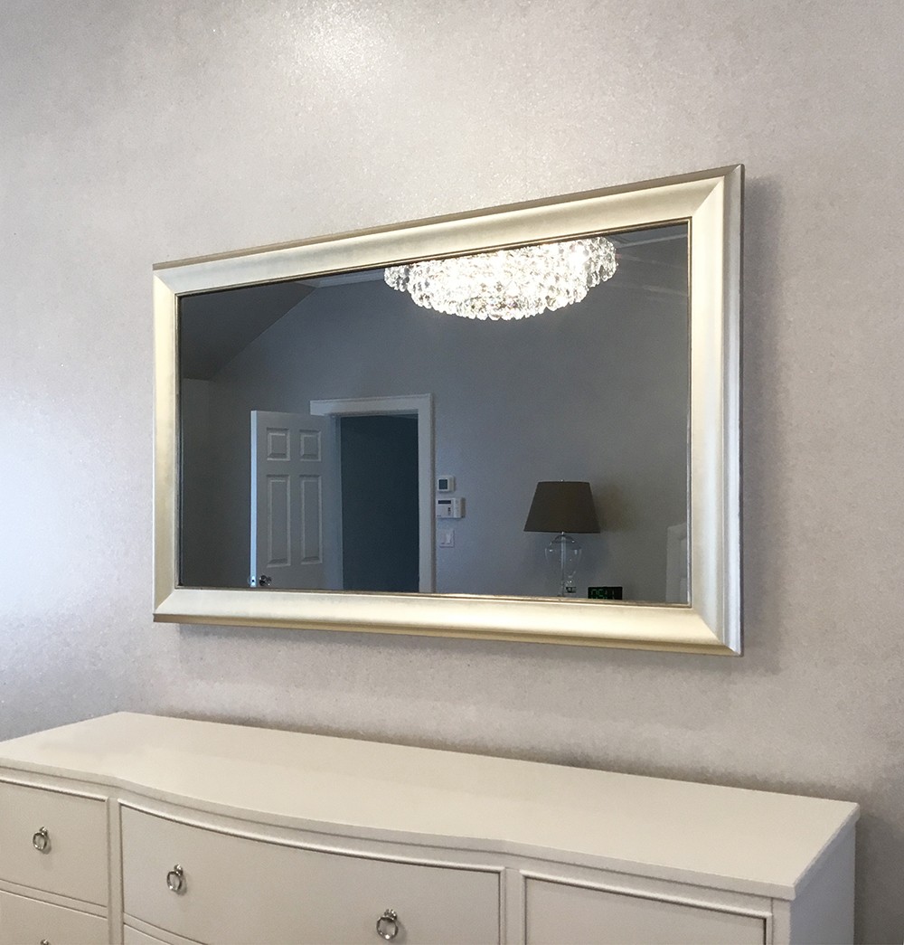 55 Inch Mirror Television Over Dresser In Bedroom
