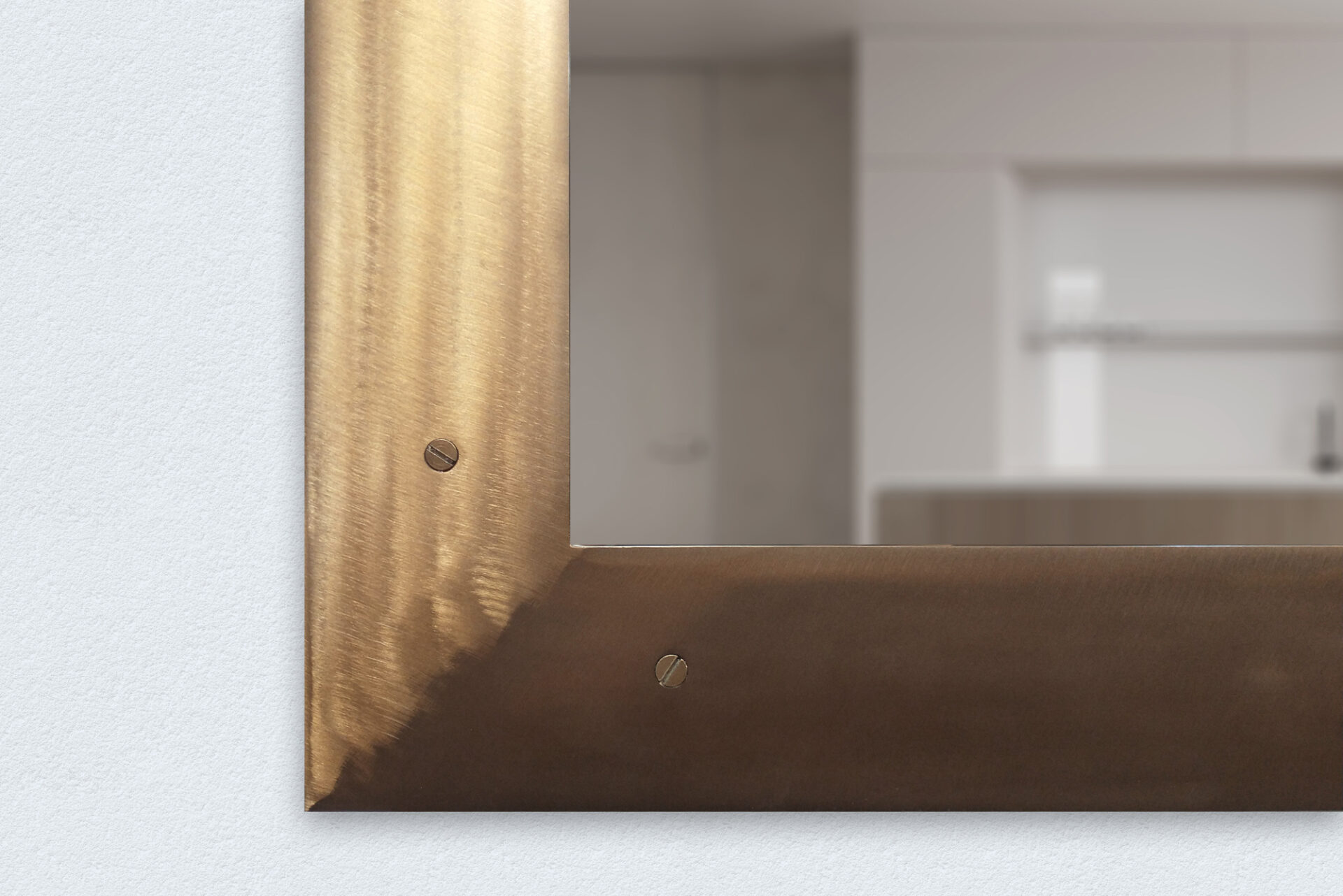 Closeup Of A Bronze Metal Tv Mirror Frame With Screws