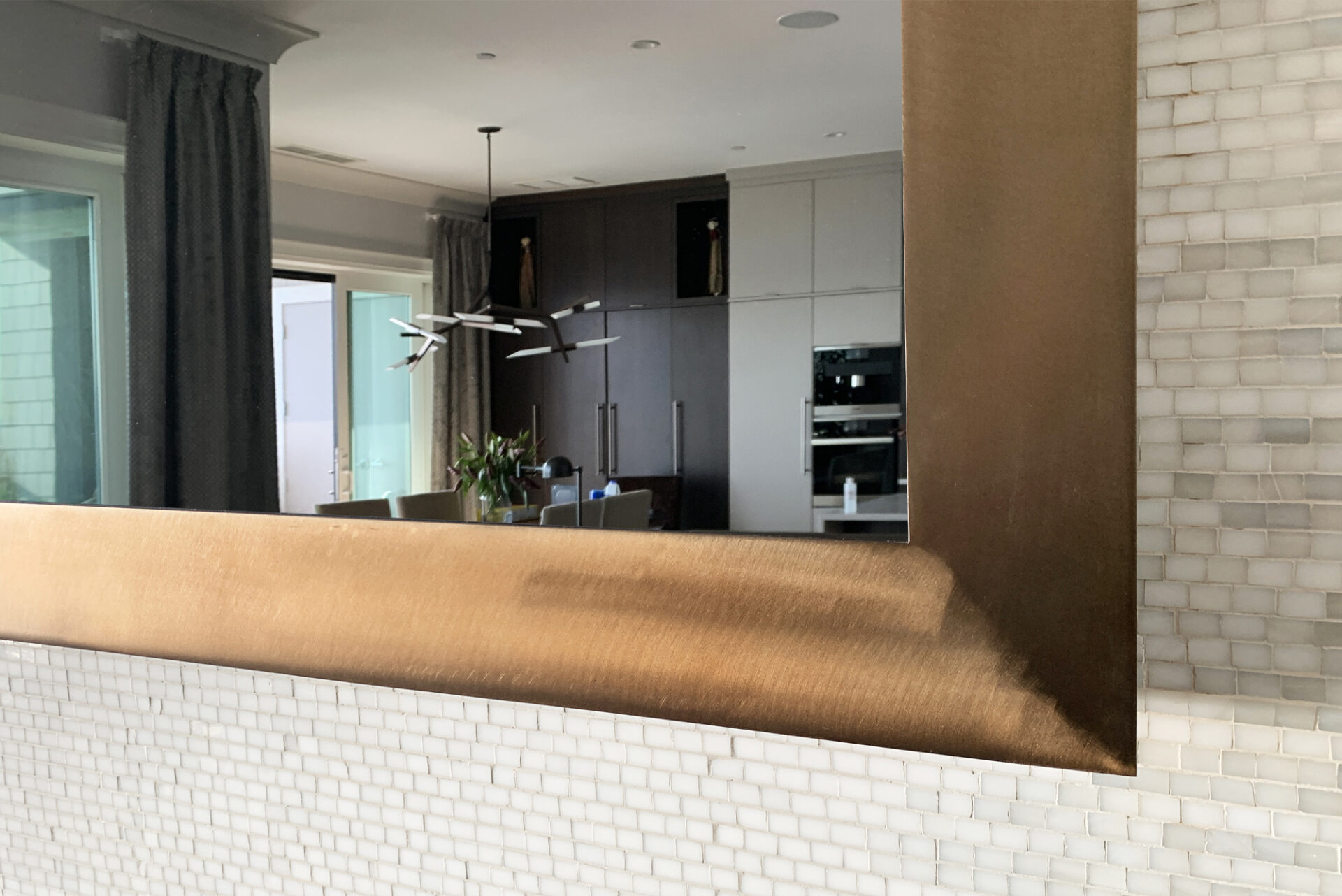 Bronze Metal Framed Tv Mirror On Mosaic Wall