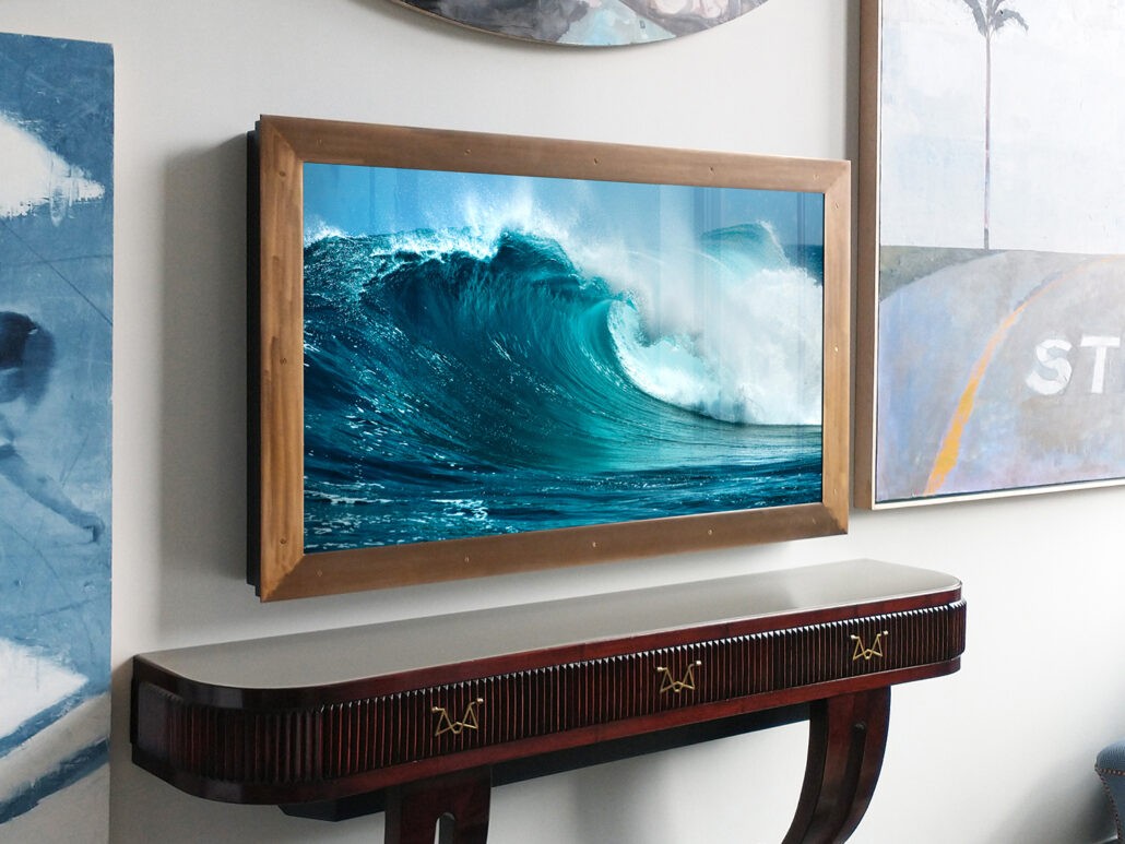 Bronze metal framed TV Mirror over living room furniture