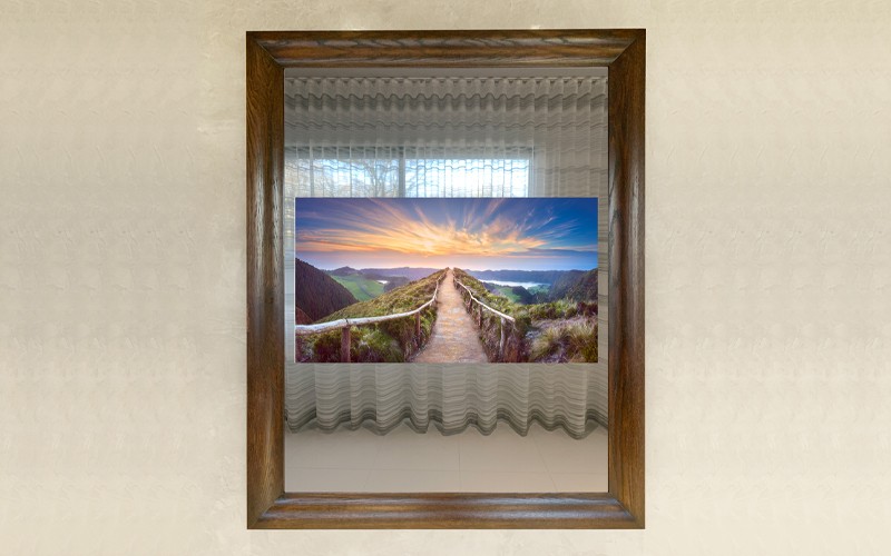 Tall Mirror Tv With A Dark Wood Frame On A Light Colored Wall