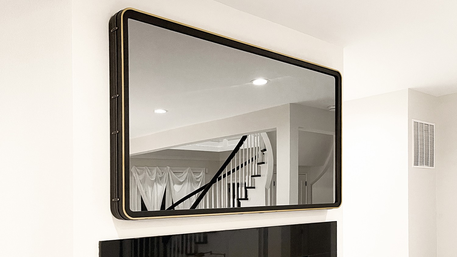 Rounded Corner Mirror Tv With Black Leather And Gilded Edges