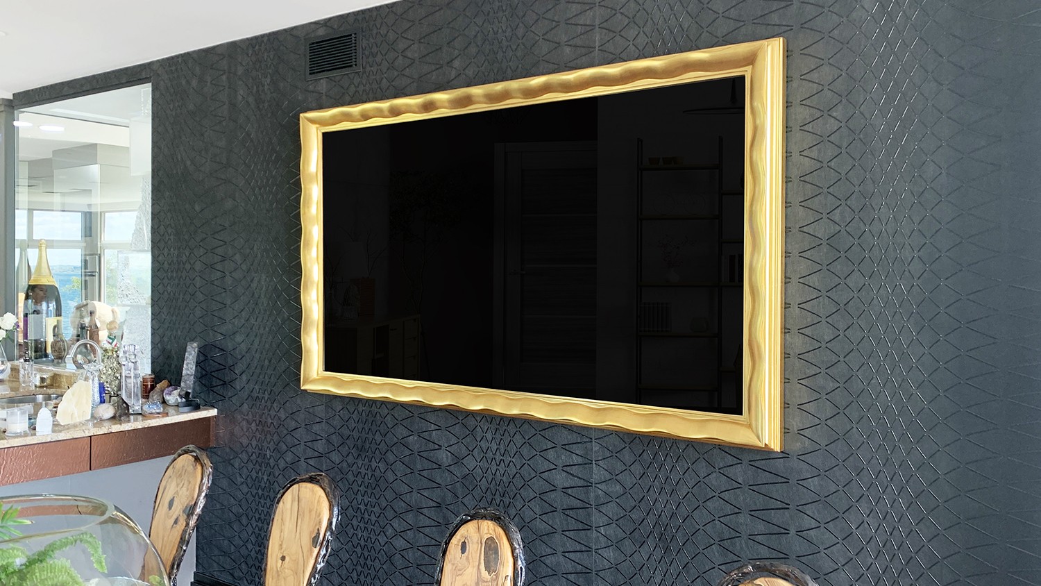 Framed TV On Wall With A Yellow Gold Frame In Dining Room