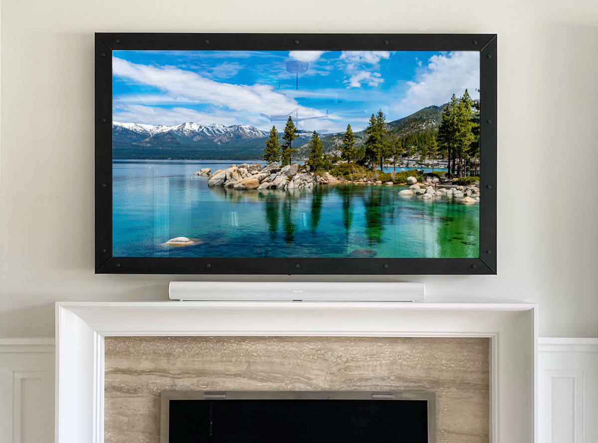 Raw Bolt Steel Framed Mirror TV Over A Contemporary Mantel Fireplace