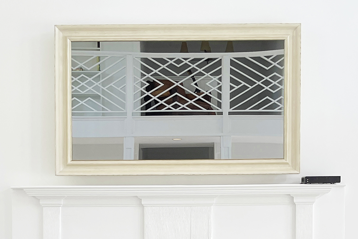 White Rustic Frame On Mirrored Tv Over White Mantel