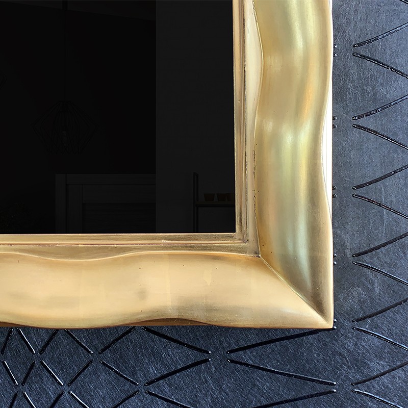 Gilded TV Frame Closeup In A Curved Design