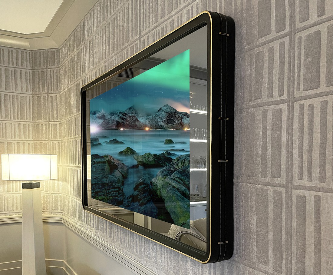 TV Mirror With A Rounded Black Leather Frame And Gilded Trim Installed At Kips Bay