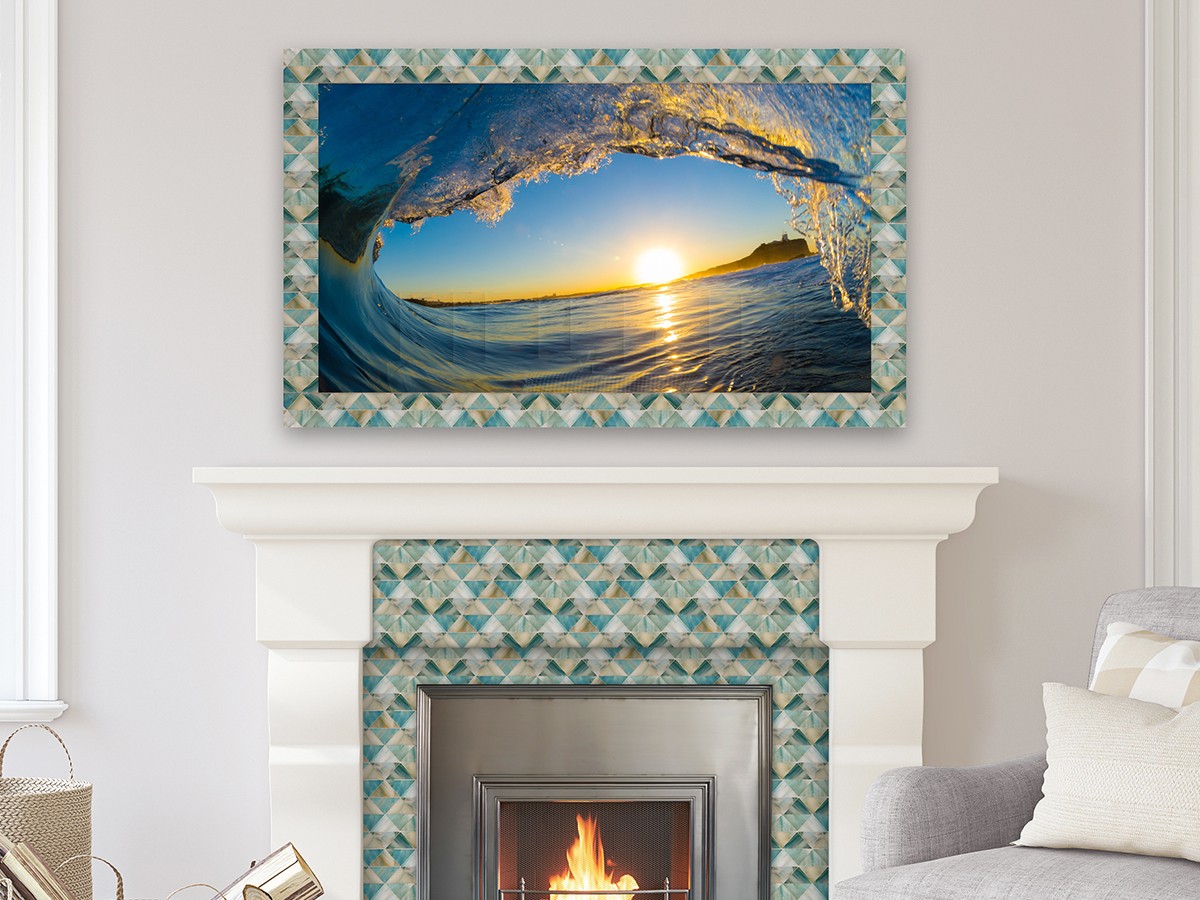 Colorful tile mosaic framed Mirror TV over a matching fireplace