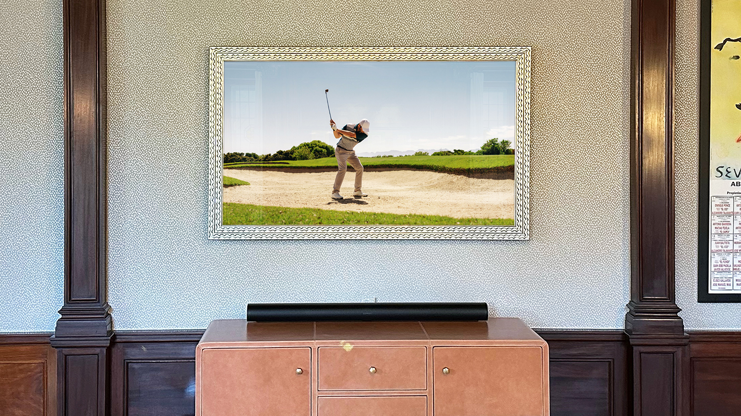 Framed Television with a scallop prefinished frame over a living room credenza