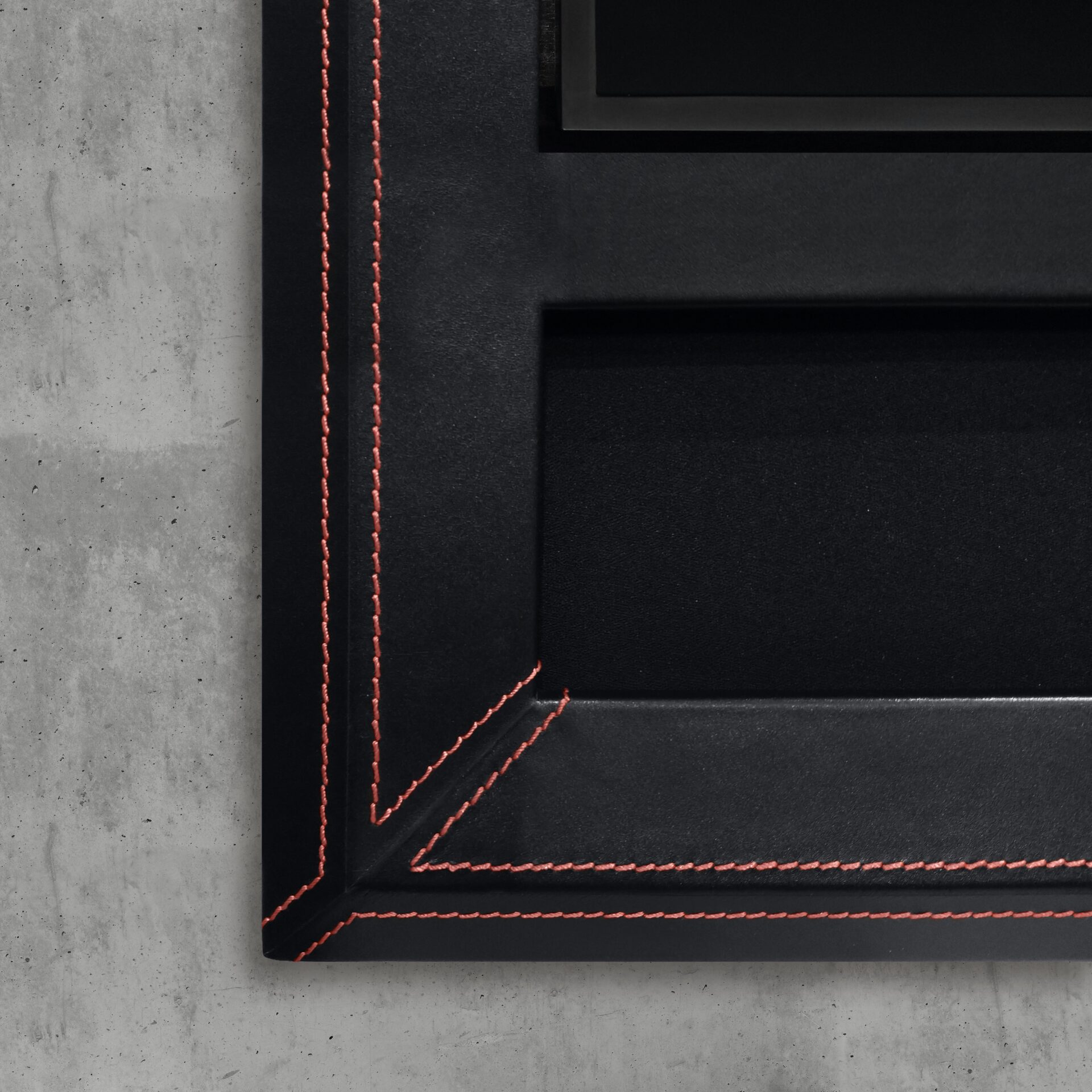 Corner Of Hidden Soundbar In Black Leather Tv Frame