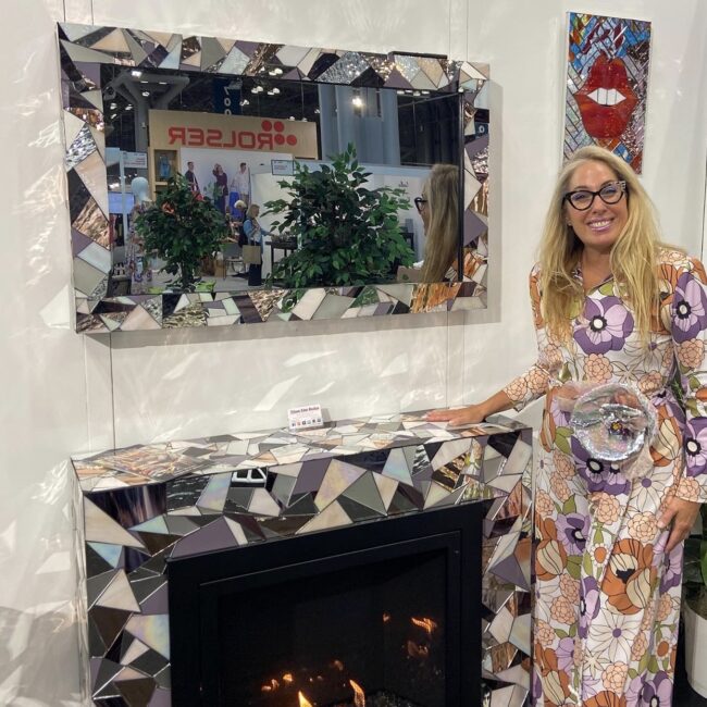 Allison Eden mosaic framed tv in mirror over matching mosaic mantel and ventless firebox