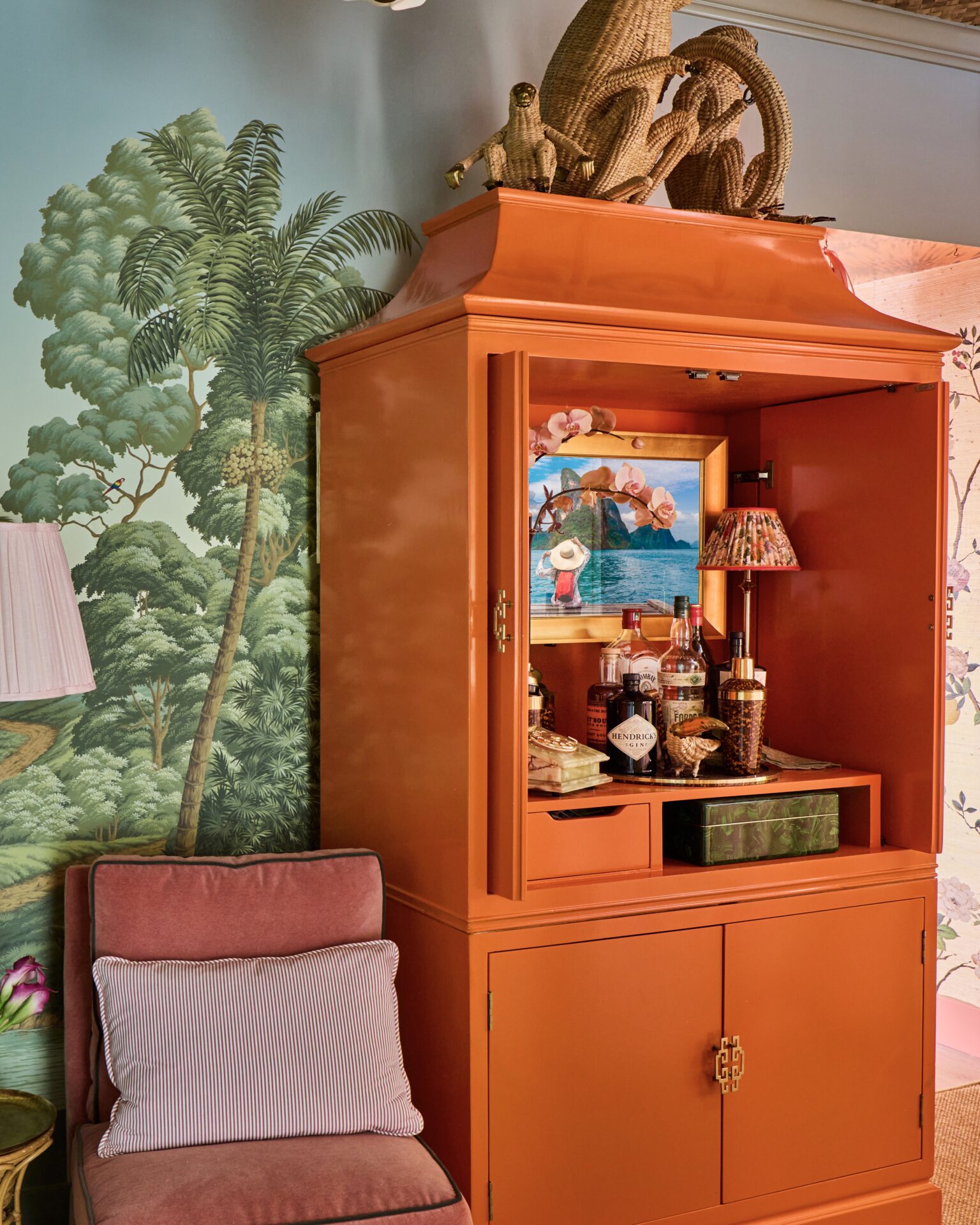 hidden tv in mirror with tv inside orange cabinet bar cart with painted walls in the kips bay show house palm beach designer tartan and toile
