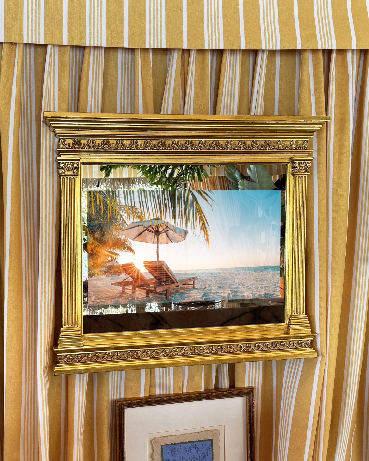 gilded carved framed tv in mirror with framed tv on tabernacle shaped in the tiki tent at kips bay palm beach