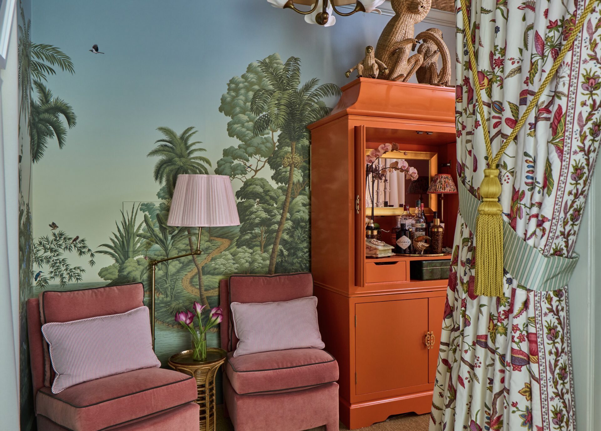 hidden tv mirror in cabinet, orange armoire with tv framed mirror with gold tv frame inside in tartan and toiles entertainment command center at the kips bay showhouse palm beach