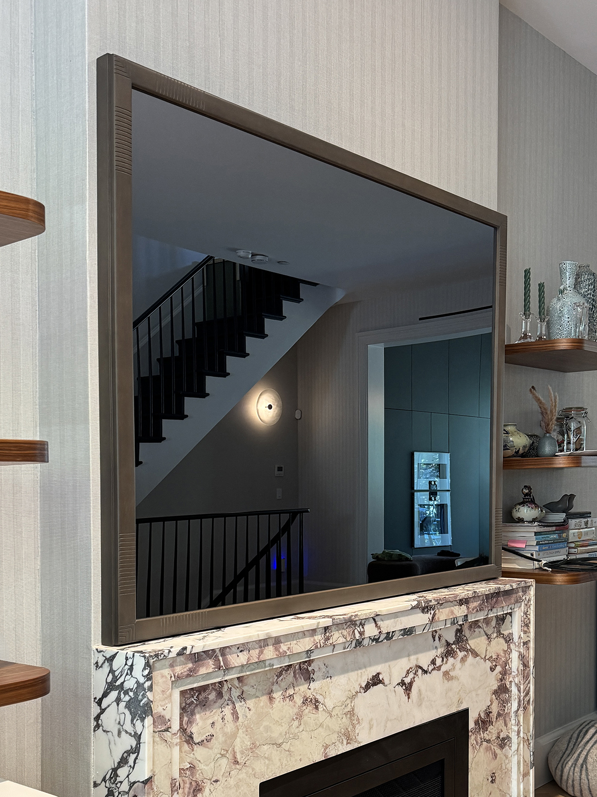 Turned Off Mirror Tv Recessed Into Wall Over Marble Fireplace Mantel