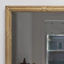 Gilded Carved - GC52-B Gilded carved frame on a Mirror Television Portrait orientation with screen off in living room