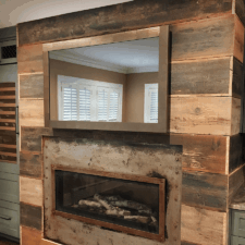 55" Landscape - Metal Nassau County Long Island rustic fireplace and industrial metal framed tv in den