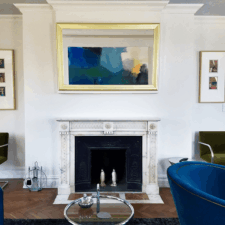 55" Landscape - Gilded Shaped 49 television on tv mount Modern Shaped Frame in living room interior over mantel