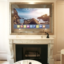 75" Landscape Plus - Gilded Carved the most custom gold gilded carved frame in the mirror tv industry over marble fireplace