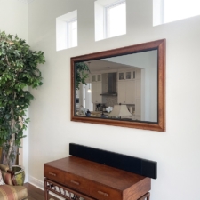 65" Landscape - Specialty Wood - Birdseye Maple living room television recessed with birds eye maple wood and custom black liner