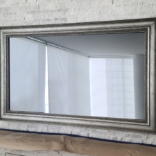 55" Landscape - Signature Carved Samsung Mirror TV in an edge to edge frame and industrial silver frame and liner over fireplace in NYC Lower Manhattan apartment