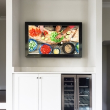 55" Landscape - Signature Elite economical framed television with mirror black smoke over wine cabinet