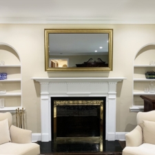 55" Landscape - Signature Carved* economic prefinished mirror tv in living room interior and traditional fireplace