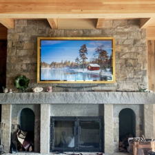 77" Landscape Plus - Gilded Shaped 77 inch best Samsung tv concealment system over stone fireplace in rustic home in Connecticut with AV by HiDef