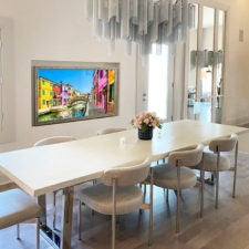 65" Landscape - Signature Carved Tribeca loft elegant interior design and concealed television with silver frame in dining room in recessed niche