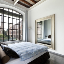 Portrait Plus - Gilded Shaped portrait television mirror in nyc loft apratment