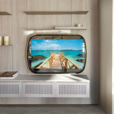 55" Ellipse Contour - Leather w/ Gilded Lip Mirror TV in an ellipse shape with black leather with gold installed in Southampton Ornare showroom