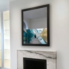 43" Portrait - Metal Tall portrait Mirror TV with a black metal frame over mantel