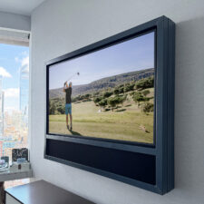 55" Landscape Floater - Cortina Leathers blue framed tv with integrated soundbar over bedroom dresser in nyc