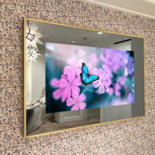 55" Landscape Plus - Specialty Metal Brushed Brass mirror tv with a thin brass metal frame installed over floral wallpaper