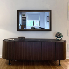 55" Landscape - Signature Elite Mirror TV over living room credenza with prefinished brown frame