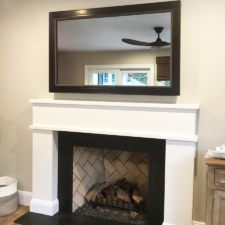 55" Landscape - Signature Leatherette 55inch edge to edge mirror tv dark leather like frame over white mantel