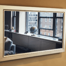 55" Landscape - Gilded Shaped simple and elegant white gold frame landscape edge to edge in NYC apartment